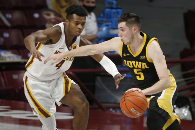 C.J. Fredrick putting the ball on the floor against Iowa State 