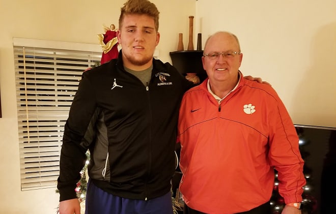 Putnam is shown here with Clemson offensive line coach Robbie Caldwell during an in-home visit earlier this month.