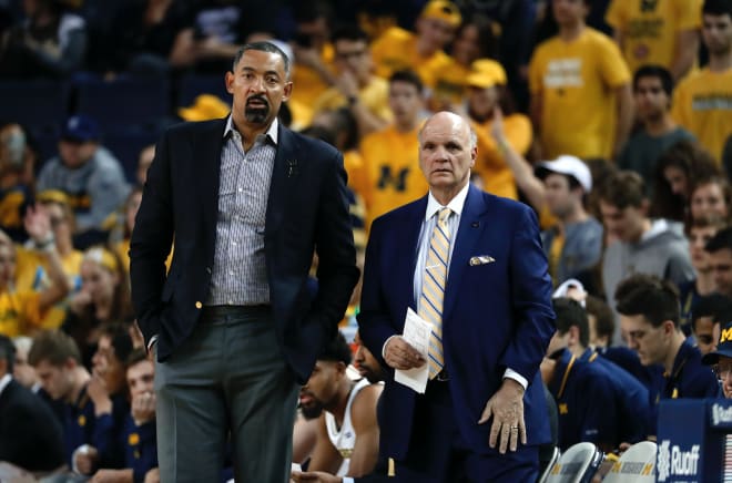 Michigan Wolverines head coach Juwan Howard and assistant Phil Martelli have bonded in their year together in Ann Arbor.