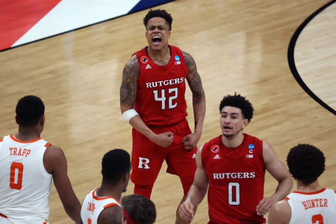 Mar 19, 2021; Indianapolis, Indiana, USA; Rutgers Scarlet Knights guard Jacob Young (42) celebrates on the court after defeating the Clemson Tigers in the first round of the 2021 NCAA Tournament at Bankers Life Fieldhouse. 