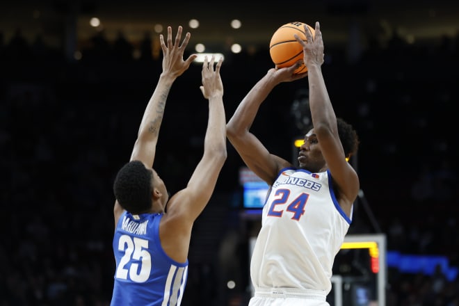 Boise State forward Abu Kigab (24) shoots over Memphis guard Jayden Hardaway (25) during the first half of a first round NCAA college basketball tournament game, Thursday, March 17, 2022, in Portland, Ore.