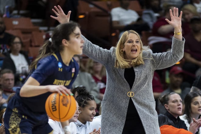 Notre Dame guard Sonia Citron brings the ball up the court as Maryland coach Brenda Frese implores her team to bring the pressure. 