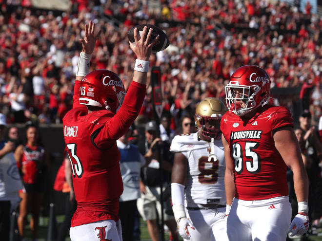 Louisville quarterback Jack Plummer celebrates with tight end Nate Kurisky following a touchdown against Boston College on Saturday.