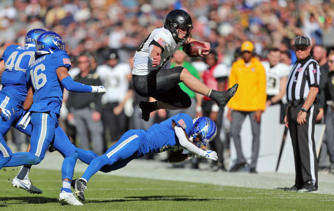 QB Bryson Daily in action during win over academy rival, Air Force ... by the way, this photo is "Photo of the Year"!