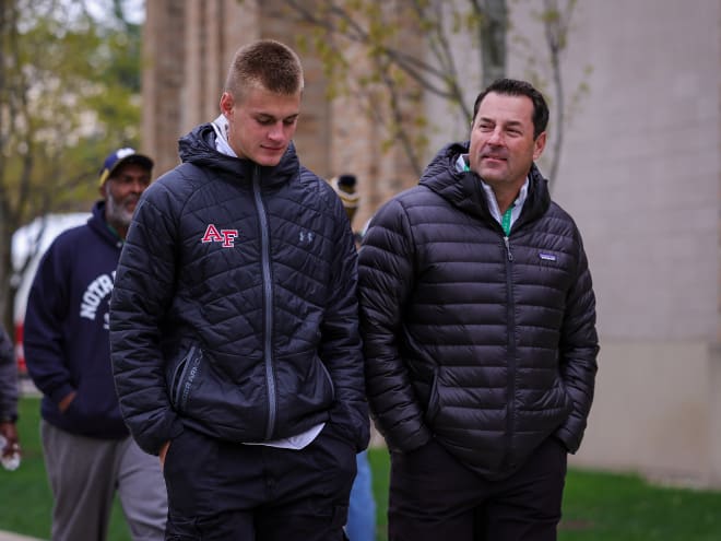 Three-star athlete Davis Andrews (left) walks to Notre Dame Stadium with his father.