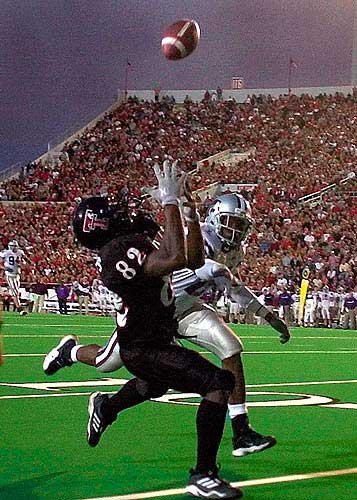 Francis snags a 33-yard pass from Kingsbury in an upset victory over K-State. Photo credit -- Lawrence Journal World