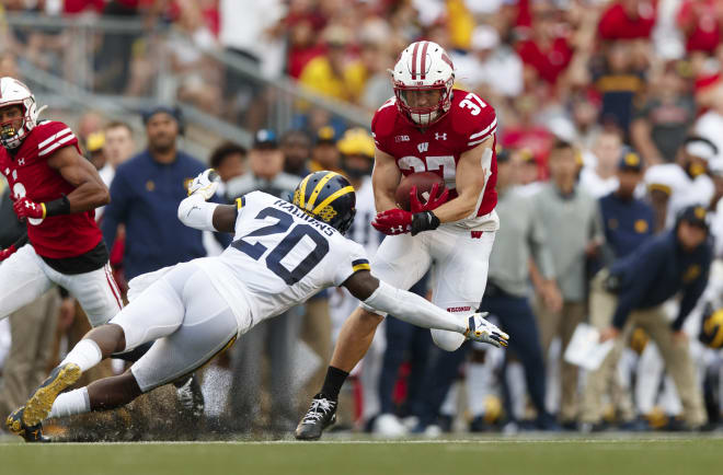 Junior safety Brad Hawkins tries to slow Wisconsin's incessant rushing attack, on a day where it didn't happen often.
