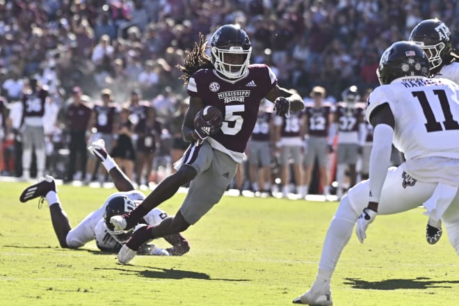 Oct 1, 2022; Starkville, Mississippi, USA; Mississippi State Bulldogs wide receiver Lideatrick Griffin (5) runs the ball while defended by Texas A&M Aggies defensive back Deuce Harmon (11) during the second quarter at Davis Wade Stadium at Scott Field. 