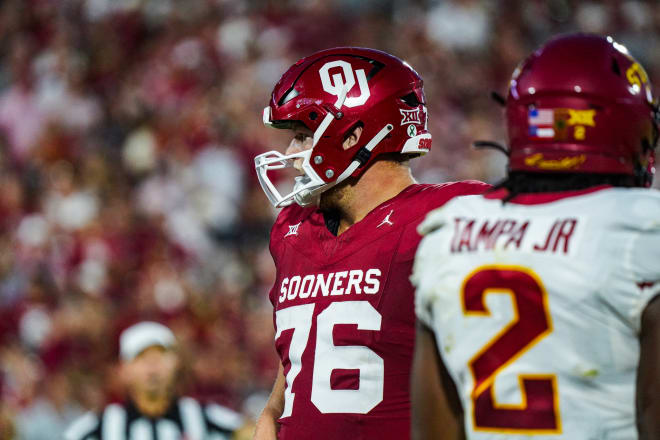 Offensive tackle Jacob Sexton looks for a signal from the sideline in the Sooners' Sept. 2023 tilt with Iowa State