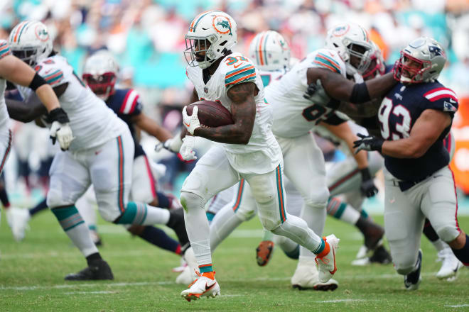 Oct 29, 2023; Miami Gardens, Florida, USA; Miami Dolphins running back Raheem Mostert (31) runs with the ball against the New England Patriots during the second half at Hard Rock Stadium. Mandatory Credit: Jasen Vinlove-USA TODAY Sports