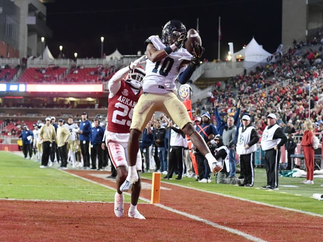 FIU wide receiver Kris Mitchell (10) caught six passes for 157 yards, including this 12-yard touchdown, against Arkansas this season.