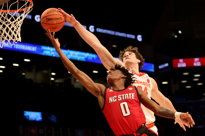 Clemson sophomore center PJ Hall blocks NC State freshman shooting guard Terquavion Smith during Tuesday's game in the ACC Tournament in Brooklyn, N.Y.