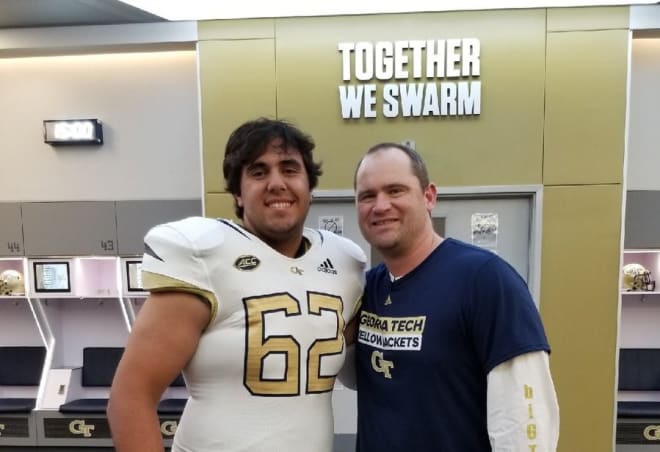 Kootsouradis poses with Jackets' offensive line coach Brent Key during his visit.