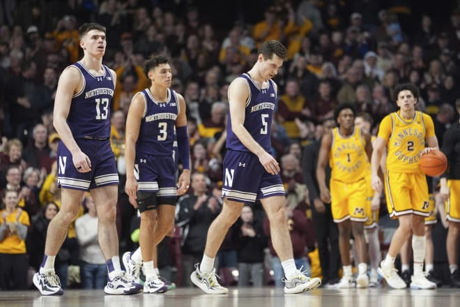Northwestern ran out of gas in a 75-66 overtime loss at Minnesota.