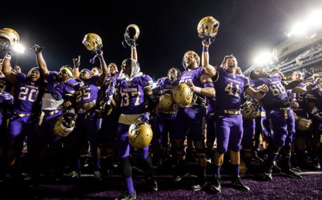 The James Madison football team celebrates after beating Morehead State in September.
