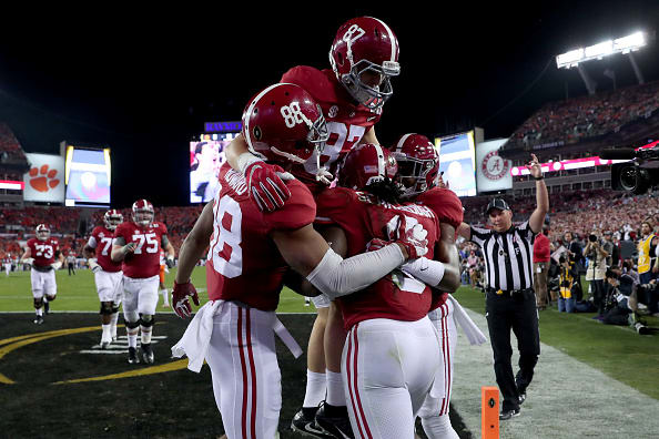 TAMPA, FL - JANUARY 09: Running back Bo Scarbrough #9 of the Alabama Crimson Tide celebrates with teammates after rushing for a 37-yard touchdown during the second quarter against the Clemson Tigers in the 2017 College Football Playoff National Championship Game at Raymond James Stadium on January 9, 2017 in Tampa, Florida. (Photo by Tom Pennington/Getty Images)