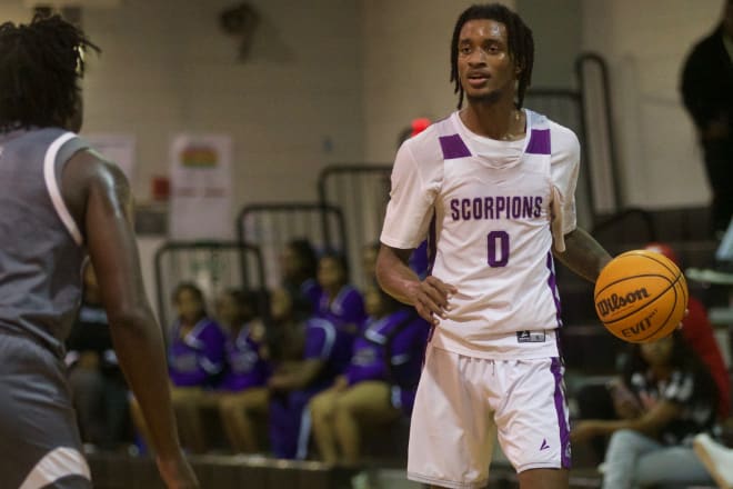 Crossroad Academy senior Kris Parker (0) looks for an open teammate in Class 2A Region 1 quarterfinal between Crossroad Academy and University Christian on Feb. 16, 2023, at West Gadsden Middle School. Photo | Jack Williams/Tallahassee Democrat / USA TODAY NETWORK