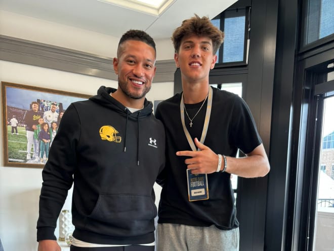 2026 quarterback Brady Hart, a four-star recruit, poses with Notre Dame head coach Marcus Freeman (left).