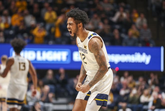 West Virginia Mountaineers guard Taz Sherman (12) celebrates during the second half against the Kansas State Wildcats at WVU Coliseum.