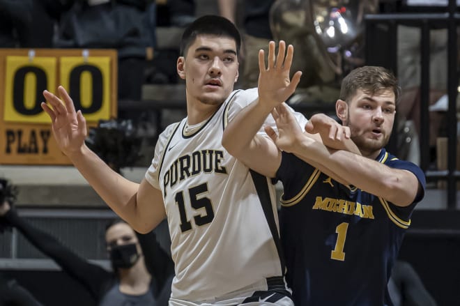 Zach Edey helped Purdue's centers combine for 32 points and 17 rebounds which offset a terrific performance by Michigan's Hunter Dickinson. 