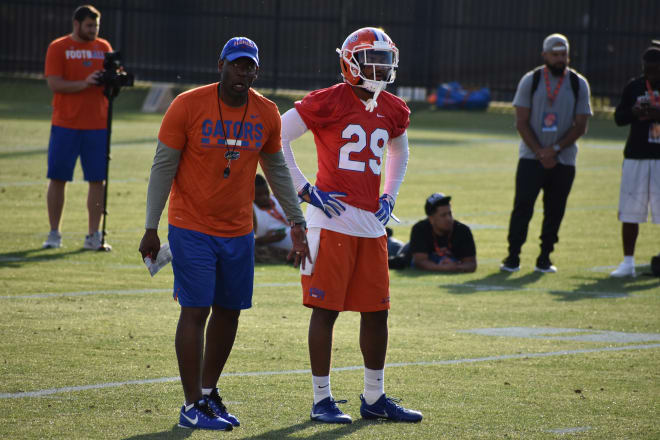 Safeties coach Ron English along with Jeawon Taylor (who was in a red non-contact jersey due to off-season shoulder surgery)