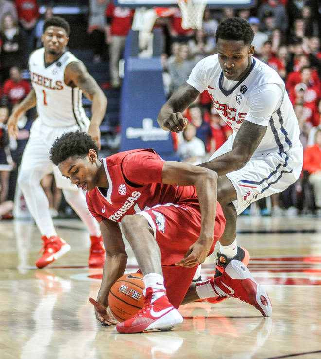 Ole Miss forward Marcanvis Hymon goes for a loose ball Saturday against Arkansas while Martavious Newby (1) looks on in the background. Hymon scored 10 points and grabbed 11 rebounds in Ole Miss' 76-60 win.