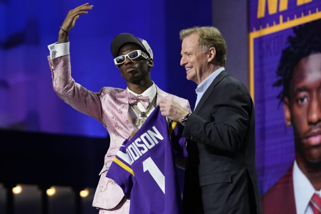 Jordan Addison on stage at the NFL draft Thursday night.