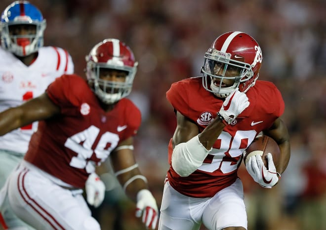 Alabama cornerback Levi Wallace returns an interception for a touchdown against Ole Miss. Photo | Getty Images