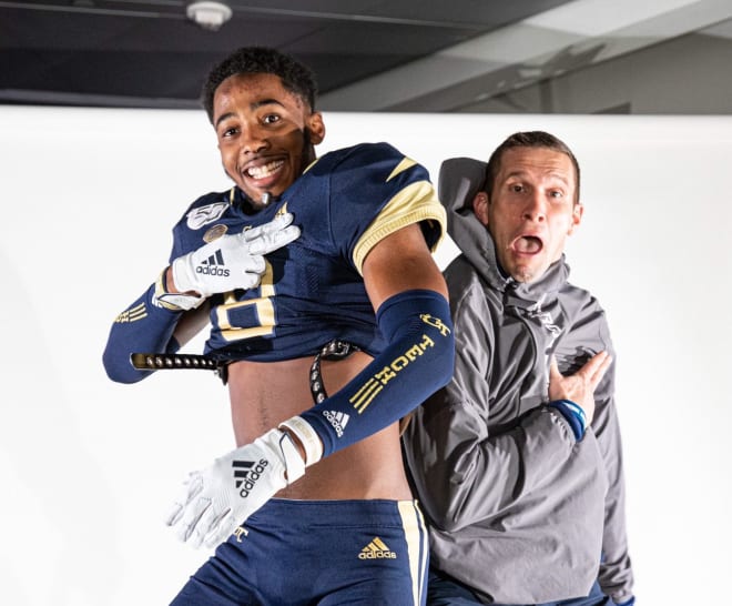 Khatavian Franks and Andrew Thacker jump up during his visit to Tech