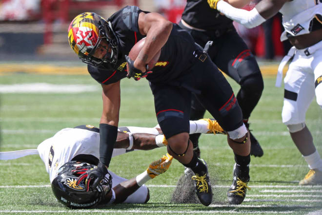 DJ Moore (No. 1) scored three touchdowns for the Terps. 