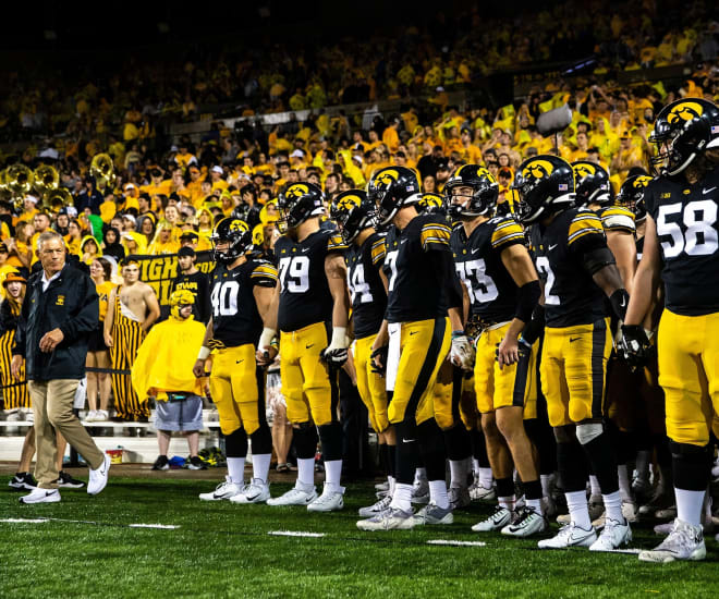 Kirk Ferentz prepares to lead his team onto the field at Kinnick Stadium.