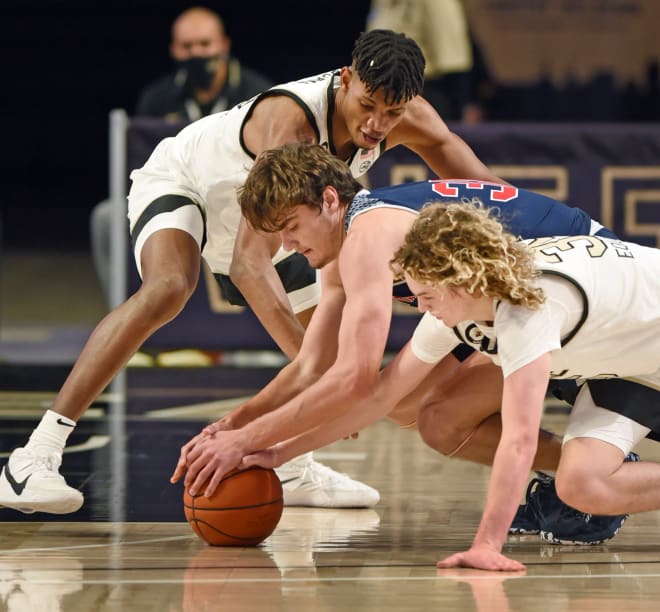 Carter Whitt dives for a loose ball on the court