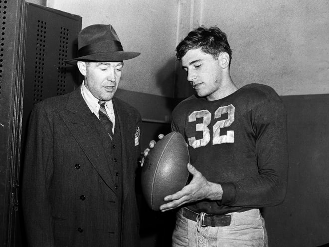 Notre Dame football coach Frank Leahy, left, and Johnny Lujack, right, are shown in the locker room after the Fighting Irish's 20-0 victory over Army in New York, Nov. 6, 1943.