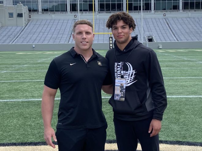 Army fullback coach Mike Viti and visiting safety prospect Caden Brungard 