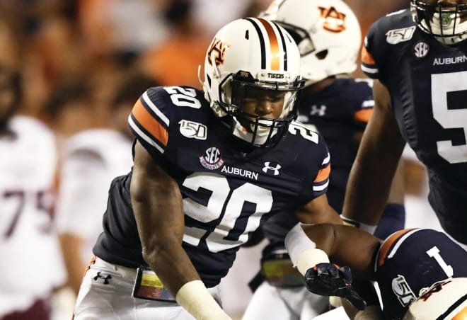 Jeremiah Dinson (20) makes a tackle during Auburn vs. Miss State.