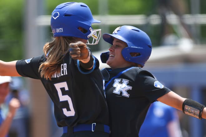 Tatum Spangler (5) and Lauren Johnson (19) celebrated during the Cats' opening win over Notre Dame on Sunday.