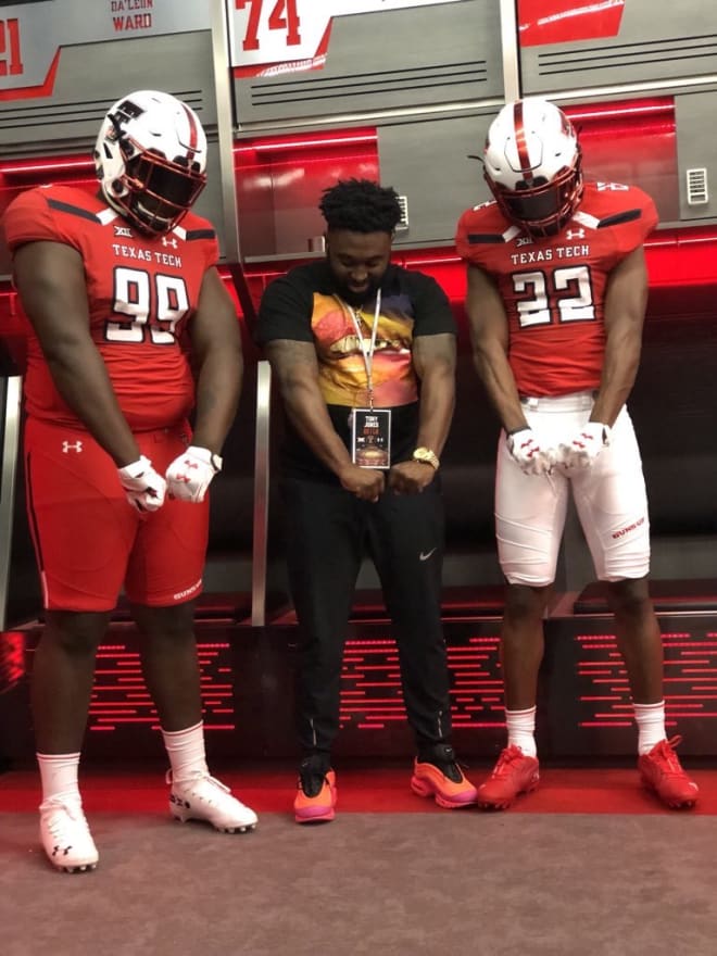 Jaqwondis Burns (22) on his visit to Texas Tech with Terrell HS coach Tony Jones and teammate Keithian Alexander (99)