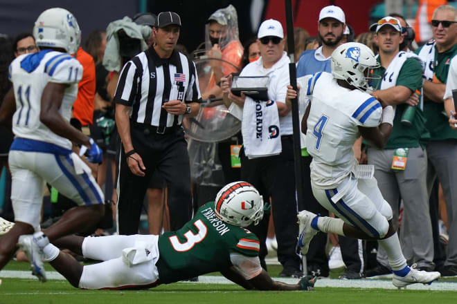 Sep 25, 2021; Miami Gardens, Florida, USA; Miami Hurricanes safety Gilbert Frierson (3) runs Central Connecticut State Blue Devils quarterback Romelo Williams (4) out of bounds during the first half at Hard Rock Stadium.