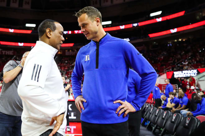 N.C. State coach Kevin Keatts, left, talks with Duke coach Jon Scheyer earlier this season. 