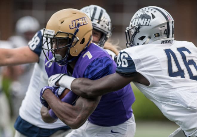 Former James Madison wide receiver Terrence Alls (7) runs after a catch during a 2017 game against New Hampshire at Bridgeforth Stadium.