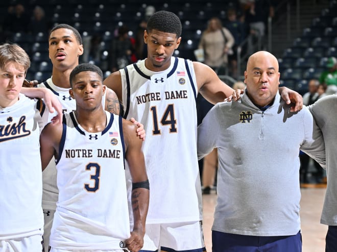 Notre Dame guard Markus Burton (3) and Kebba Njie (14) combined for a lost possession late in Notre Dame's overtime loss to Georgetown.