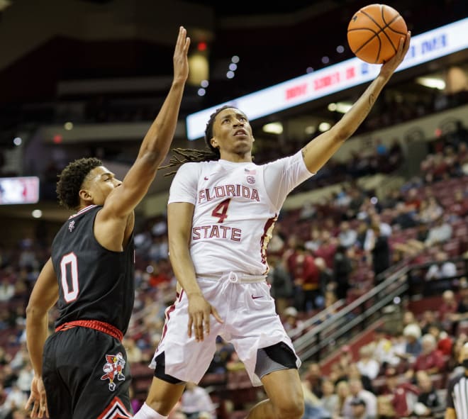 FSU sophomore Caleb Mills soars in for two of his 27 points Saturday against Louisville.