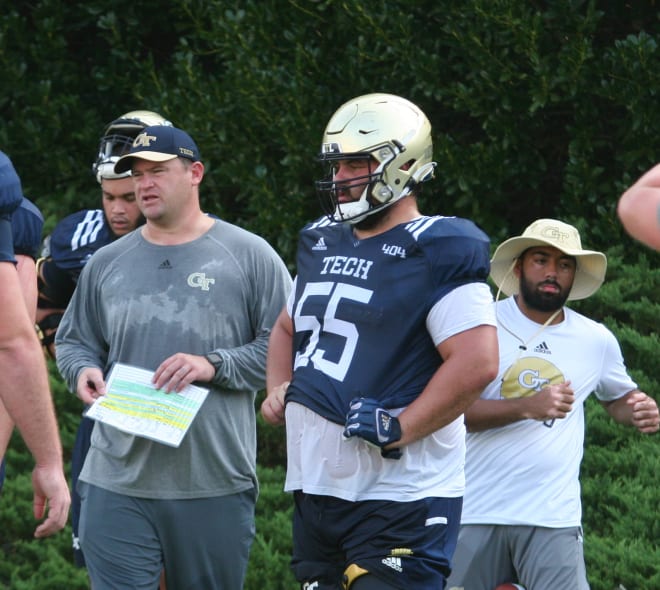 OL coach Brent Key and Kenny Cooper