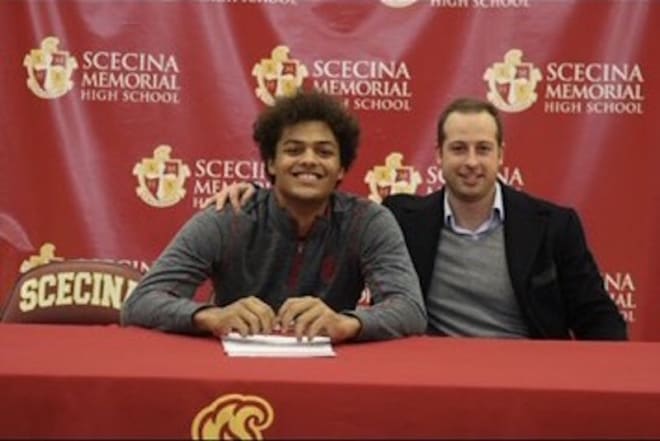 Indiana wide receiver signee David Baker with former Ball State wide receiver and current Scecina Memorial wide receivers coach Jared Scaringe during Baker's signing with Indiana on Dec. 18, 2019. (courtesy photo)