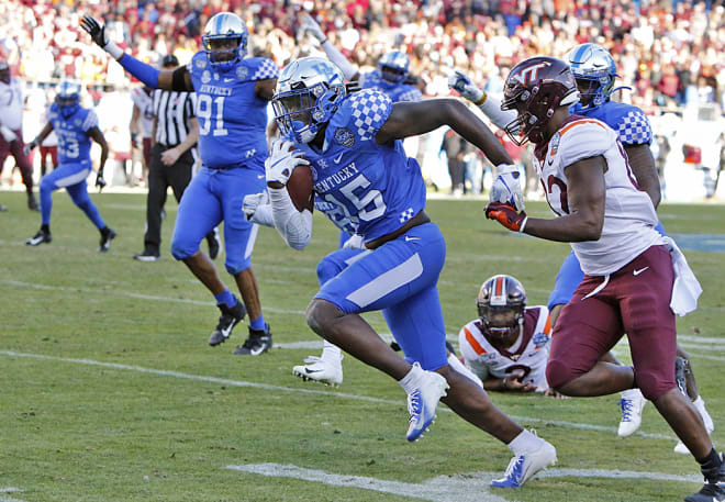 Jordan Wright scored a touchdown on a scoop-and-score fumble return to cap UK's Belk Bowl win over Virginia Tech.