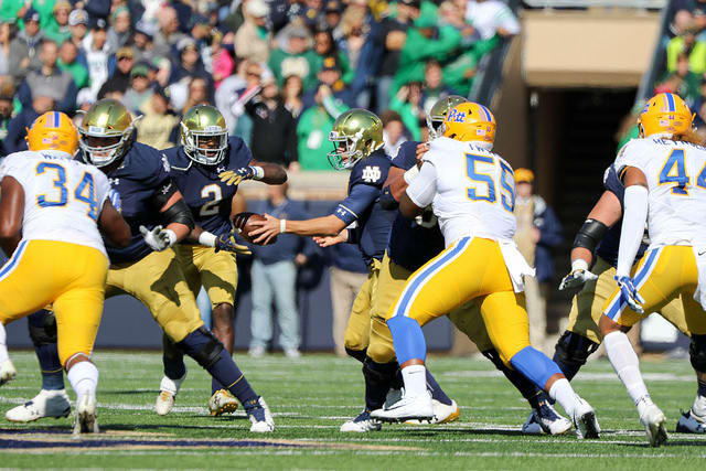 With the Notre Dame ground game limited to 81 yards, Ian Book completed 26 of 32 passes for 264 yards, two scores and two interceptions in the Irish comeback win.