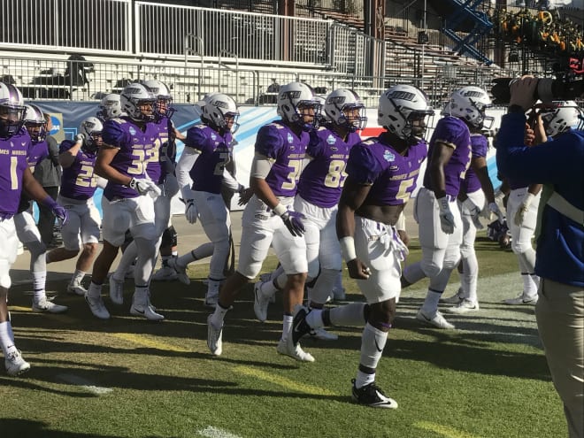 James Madison players take the field at the FCS championship game in Frisco last season.