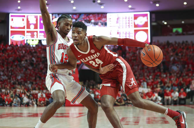 Alabama Crimson Tide forward Brandon Miller (24) drives with the ball as Houston Cougars guard Tramon Mark (12) defends during the first half at Fertitta Center. Photo | Troy Taormina-USA TODAY Sports