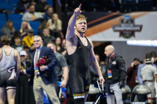 Iowa's Jacob Warner acknowledges the Iowa fans after his final collegiate match at the NCAA Tournament.