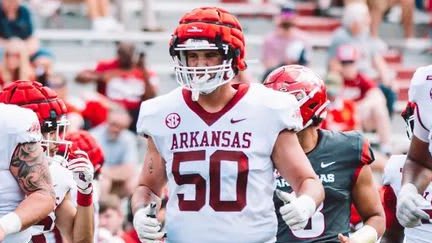 Arkansas OL Cole Carson is graduating from the program early.
